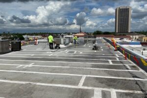 XYZ McAllen roofing company installing a thermotek roof coating.
